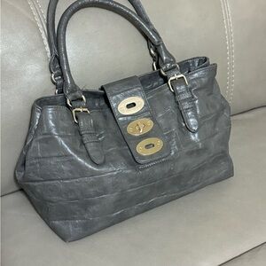 MMS statute, designer shoulder bag